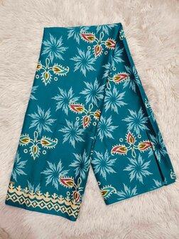 Thaise doek: motieven op turkooisgroene achtergrond